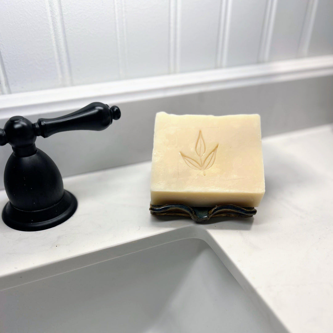 Castile bar soap with a smooth, creamy texture, scented with essential oils.