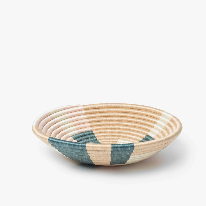 Side view of a medium Prism woven sisal bowl with a geometric design.