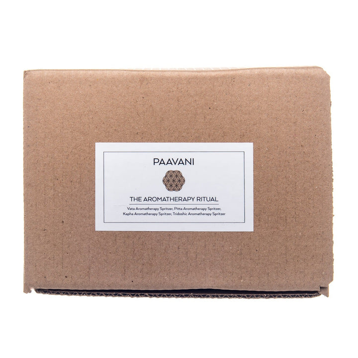 Ayurvedic aromatherapy ritual kit with essential oils and accessories.