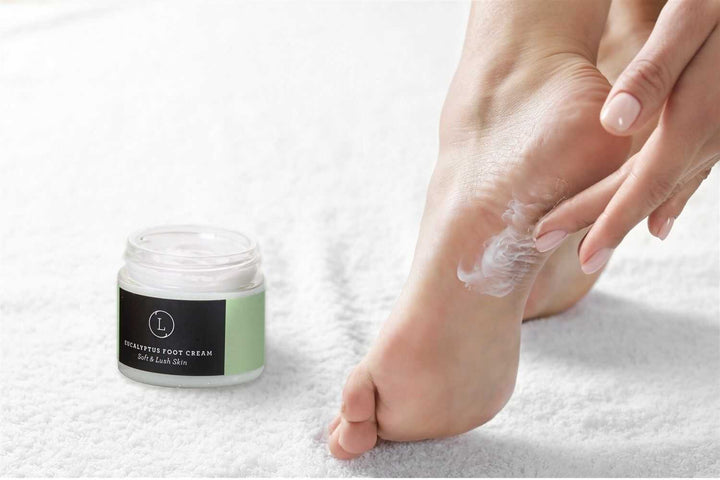 Eucalyptus shea butter foot cream in a glass jar, for soft, nourished feet.