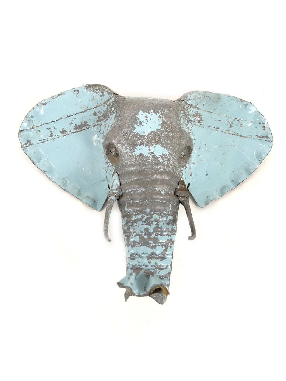 Elephant mask wall art handcrafted from recycled metal in Zimbabwe.