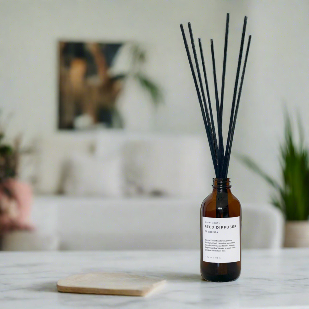 Eucalyptus reed diffuser bottle shown with rattan reed sticks.