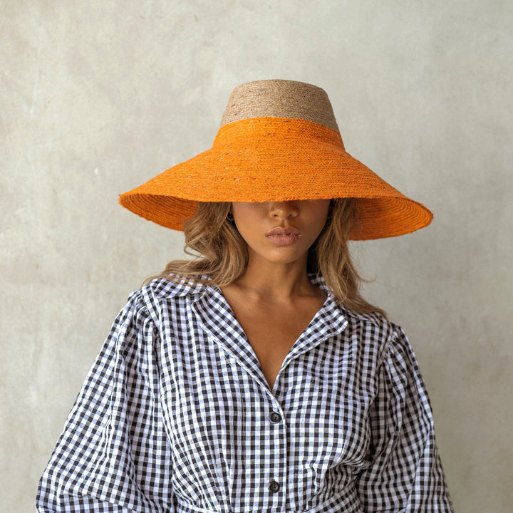 Duo jute straw hat in vibrant tangerine orange, lightweight and stylish for sun coverage and casual wear.
