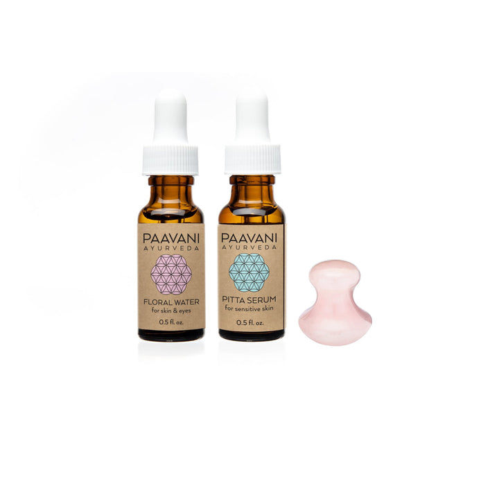 Rose quartz facial ritual set with a polished rose quartz tool for facial massage.