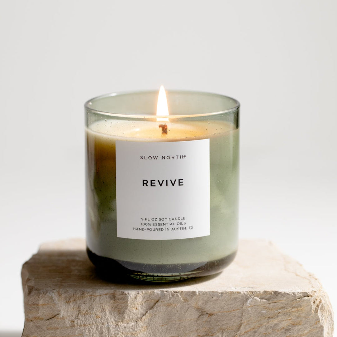 Revive Spa Collection candle with a five-oil essential blend in a green bubble glass vessel.