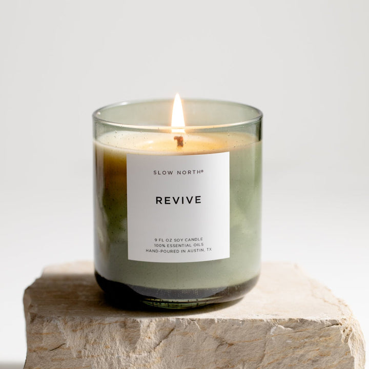Revive Spa Collection candle with a five-oil essential blend in a green bubble glass vessel.