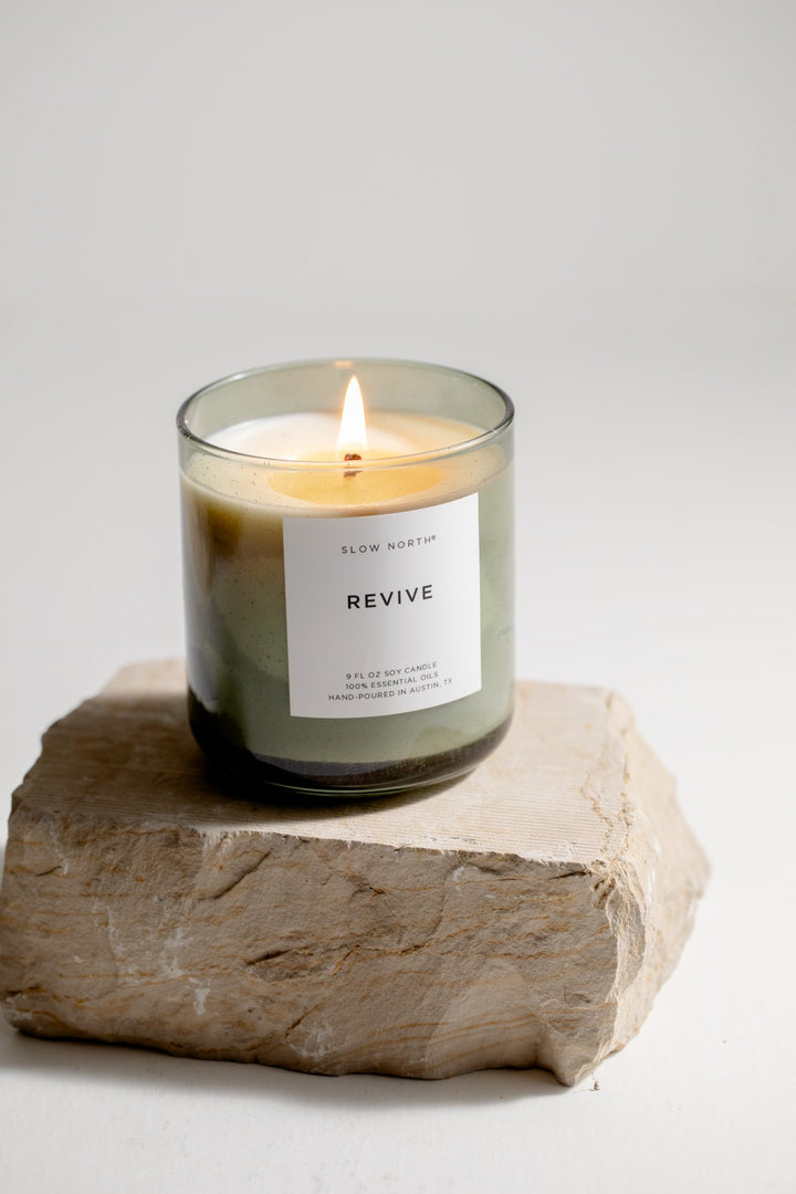 Revive Spa Collection candle in a green bubble glass vessel for relaxing ambiance.