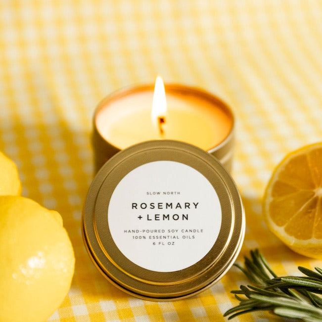 Rosemary lemon soy candle with fresh rosemary and lemon slices.