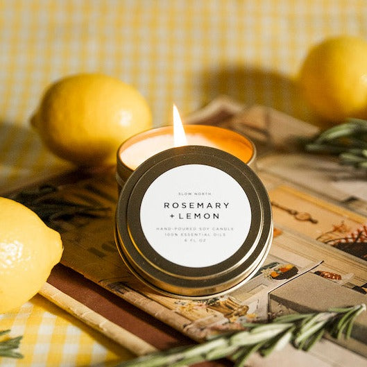 Rosemary lemon soy candle with fresh herbs and citrus in a living space.