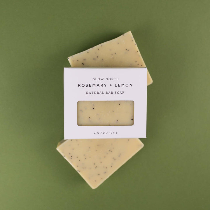Rosemary lemon bar soap shown with fresh rosemary sprigs and lemon slices.