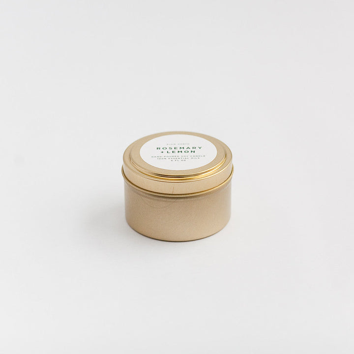 Rosemary lemon travel tin candle with fresh herbs and citrus aroma.