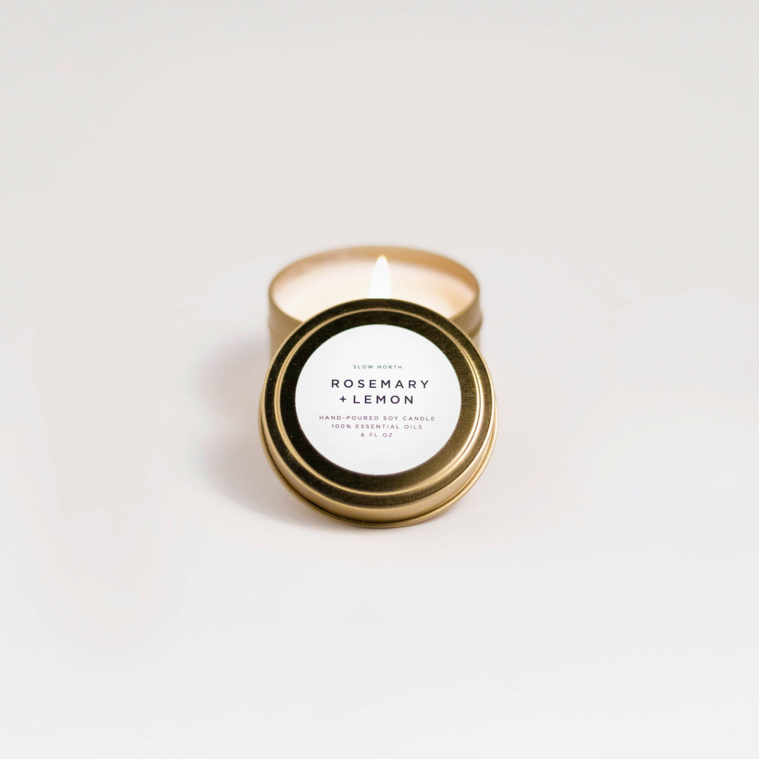 Rosemary lemon travel tin candle with cozy, aromatic soy wax in a compact tin.
