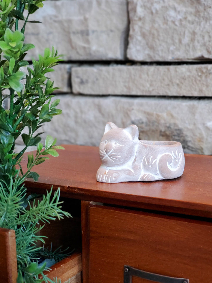 Cat-shaped terracotta candle holder styled for cozy decor