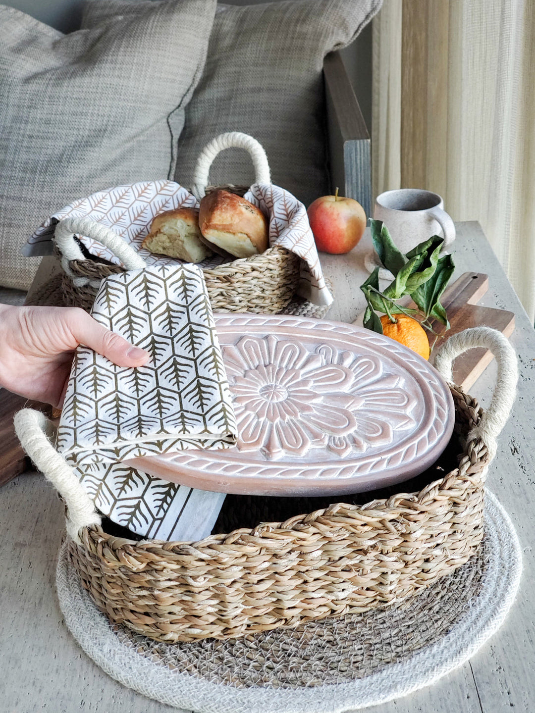 Floral bread warmer basket on a styled dining table