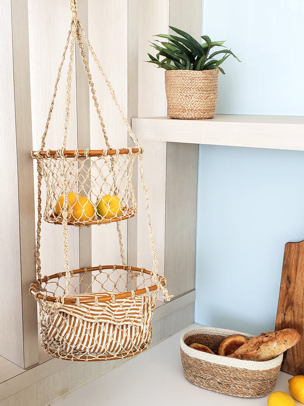 Natural jute double hanging basket by DC-KORISSA, featuring woven design and sturdy hooks for indoor or outdoor use.