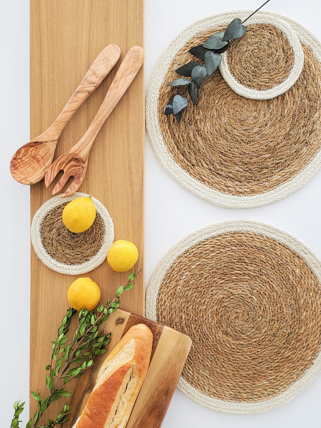 Handwoven seagrass placemat set by DC-KORISSA with natural fiber texture and earthy tones for rustic table decor.