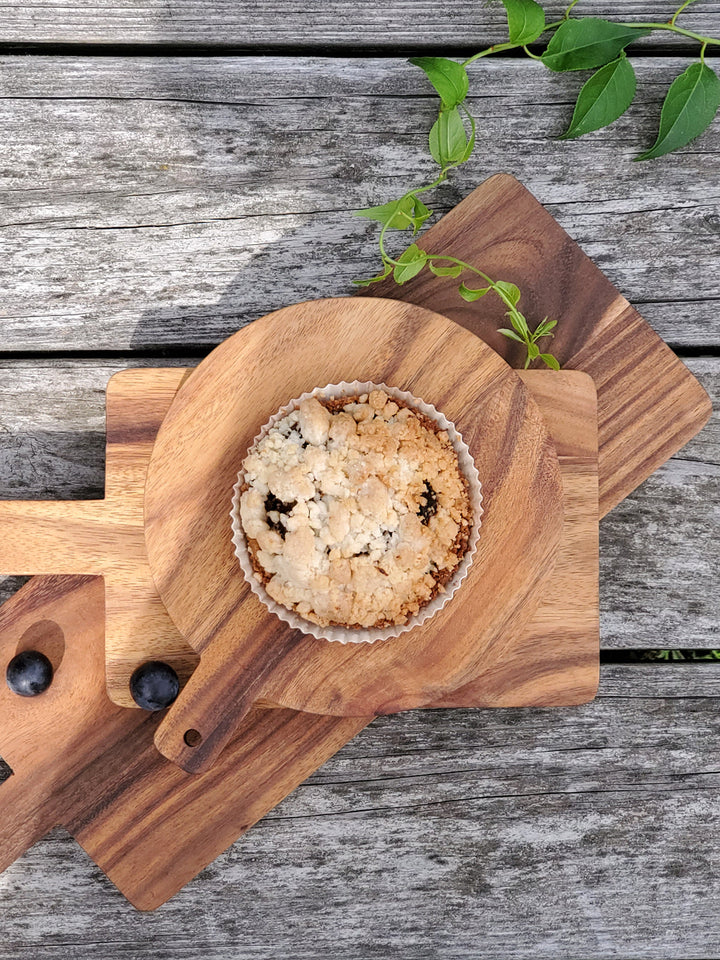 Round Albizia hardwood serving board with handle for easy serving