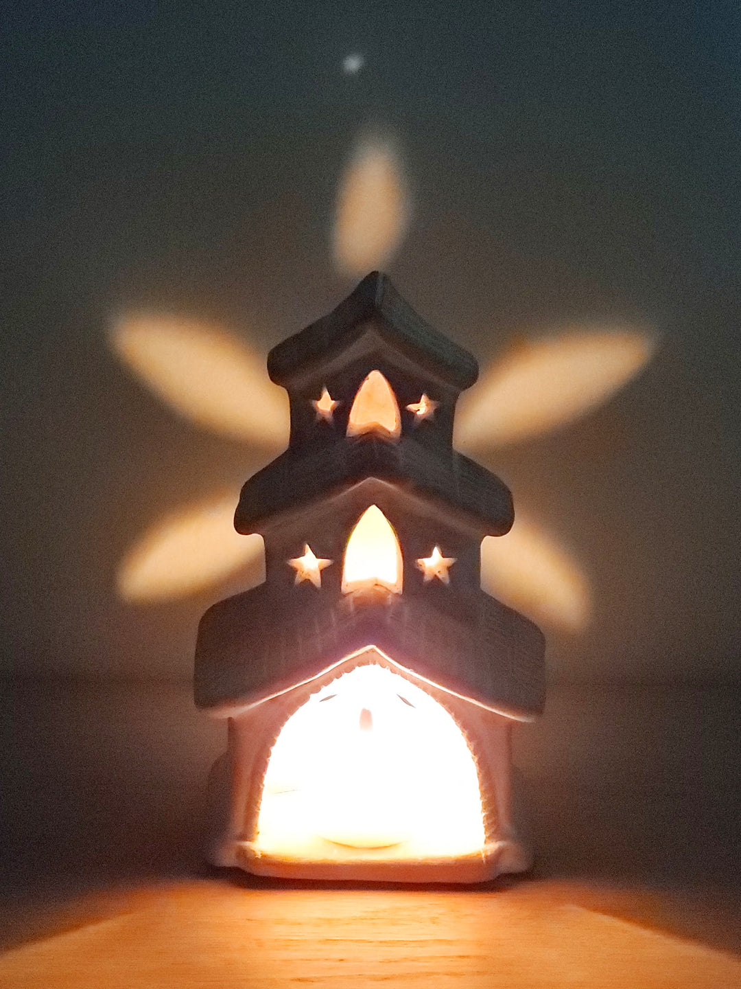 Rustic terracotta house lantern with earthy tones