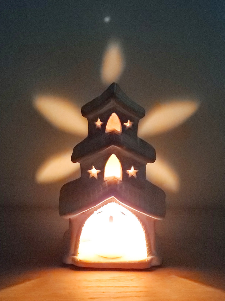 Rustic terracotta house lantern with earthy tones