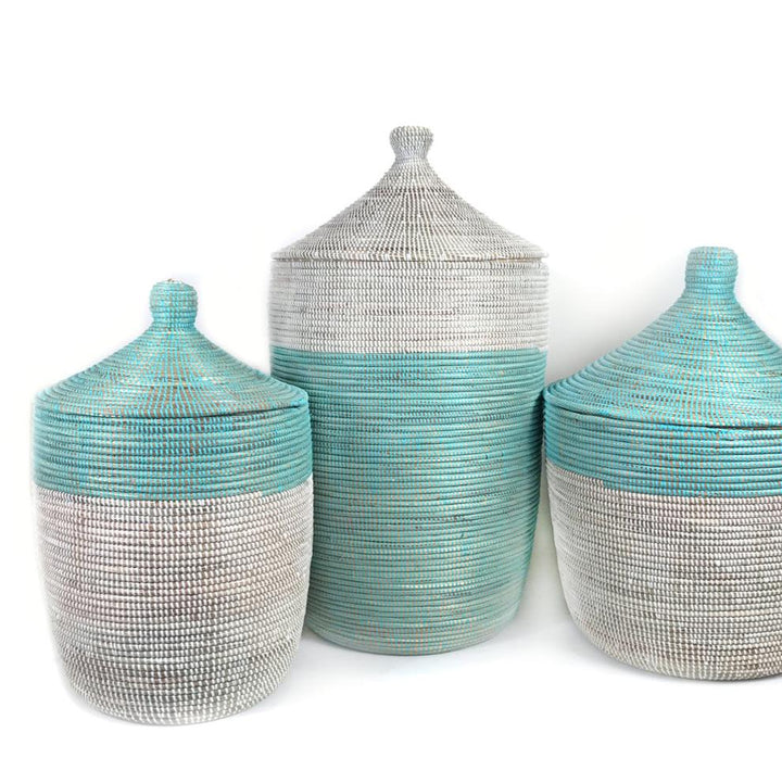 Two-tone turquoise and white woven storage basket with handles.