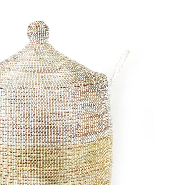 Extra-large natural and white two-tone floor basket with handles.