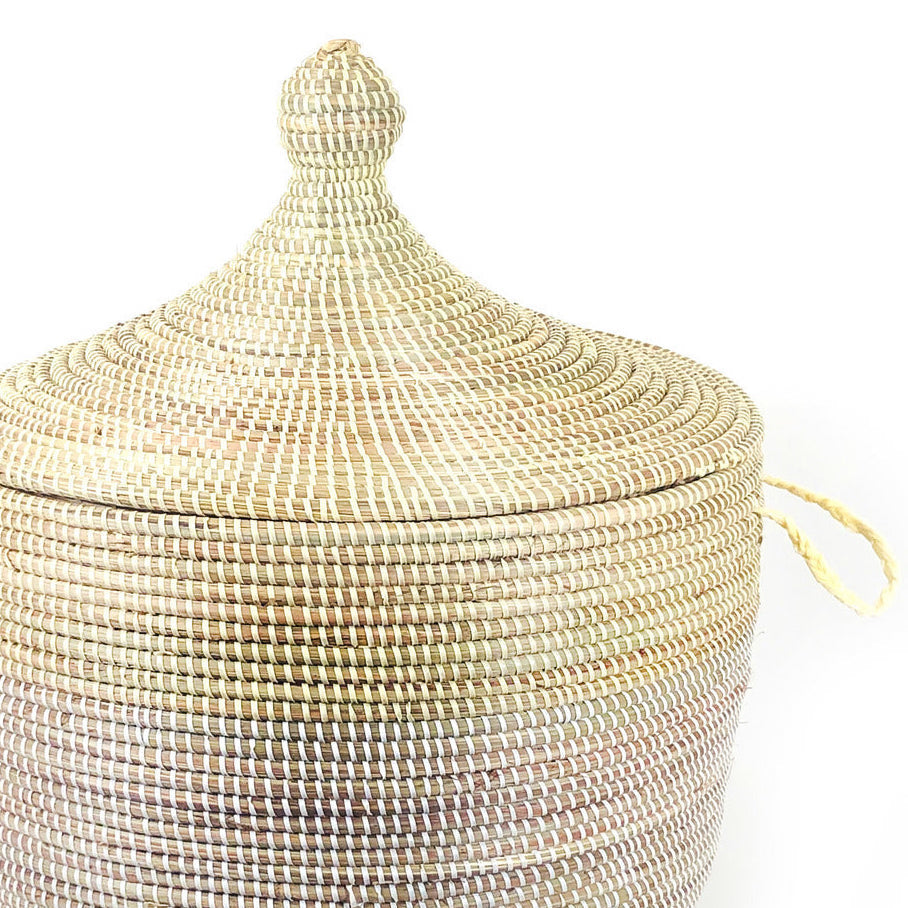 Natural and white tall two-tone floor basket with a woven pattern.