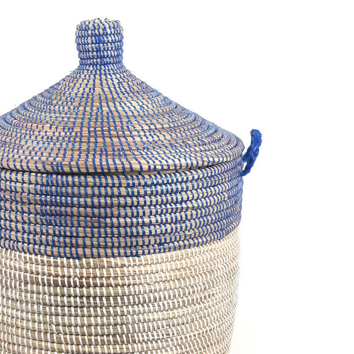 Navy and white two-tone woven basket for home storage.