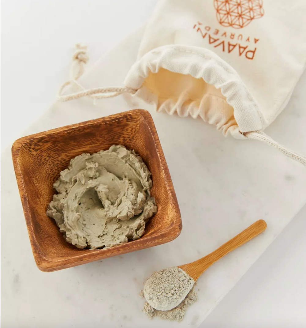 Acacia mixing bowl with a matching bamboo spoon for skincare.