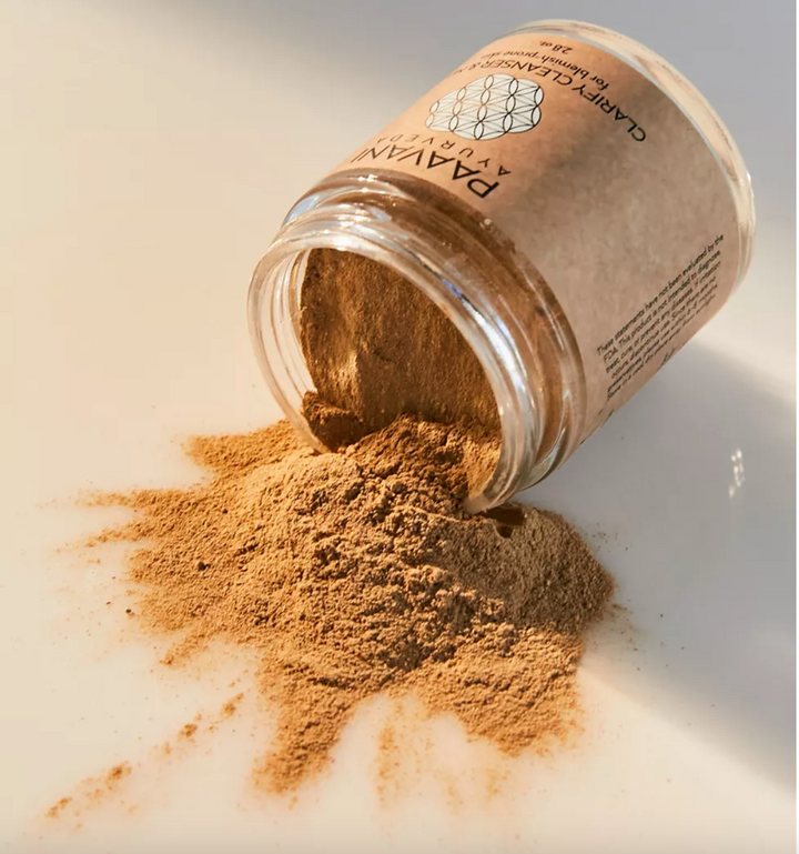 Clarify cleanser and mask with French green clay, showing the green clay texture.