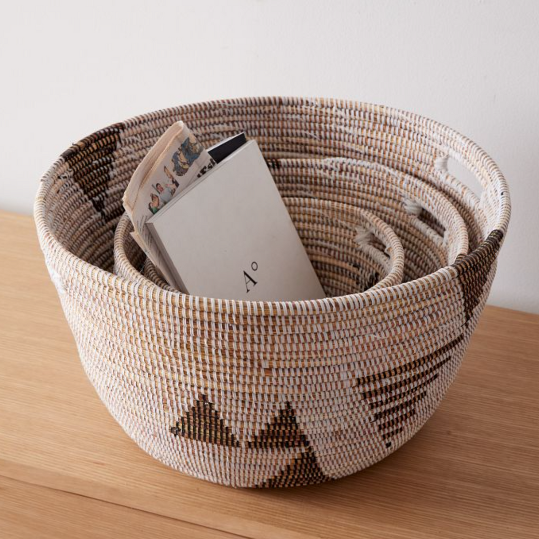 Set of three black and white graphic print oval baskets, handwoven in Senegal.