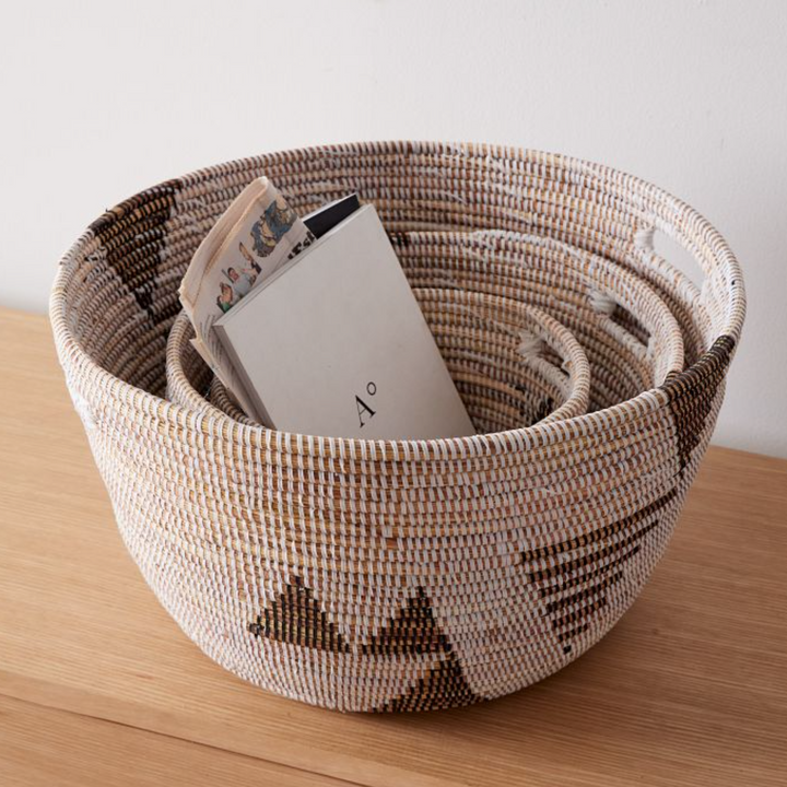 Set of three black and white graphic print oval baskets, handwoven in Senegal.
