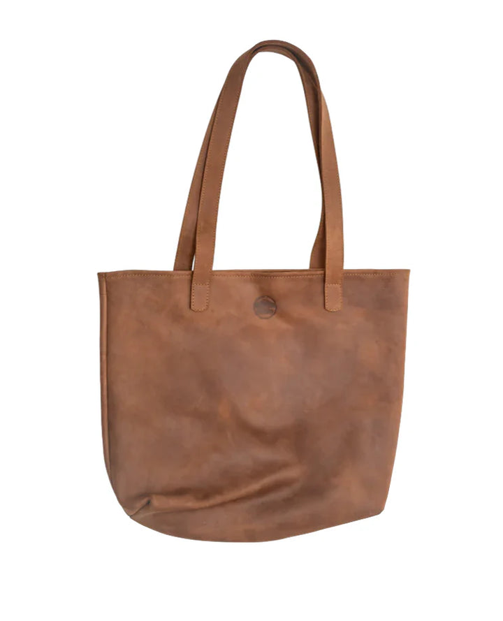 Full-grain leather tote showing its open interior and hand-stitched handles.