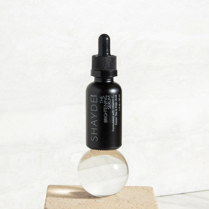 Vitamin C brightening serum with kojic acid in a bottle with a dropper.