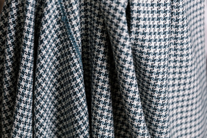 Close-up of the slate and white pinwheel check in hand-spun cotton.
