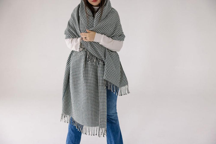 Slate pinwheel cotton throw wrapped around a person&