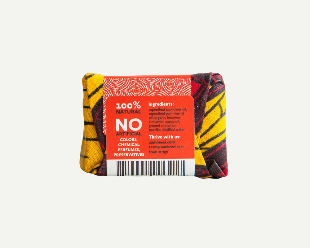 Cassia soap bar with cinnamon, back view in a natural setting.