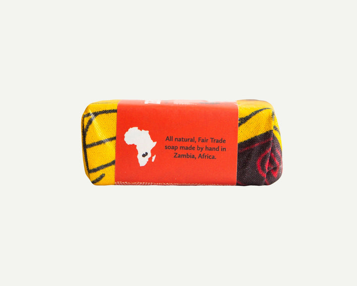 Cassia soap bar with cinnamon, textured side showing warm cinnamon tones.