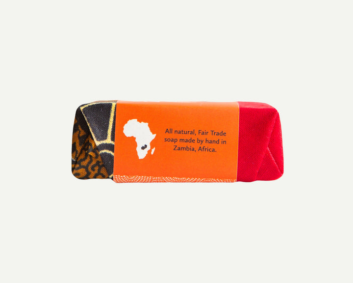 Handcrafted clove soap bar, side view with textured surface and natural color.