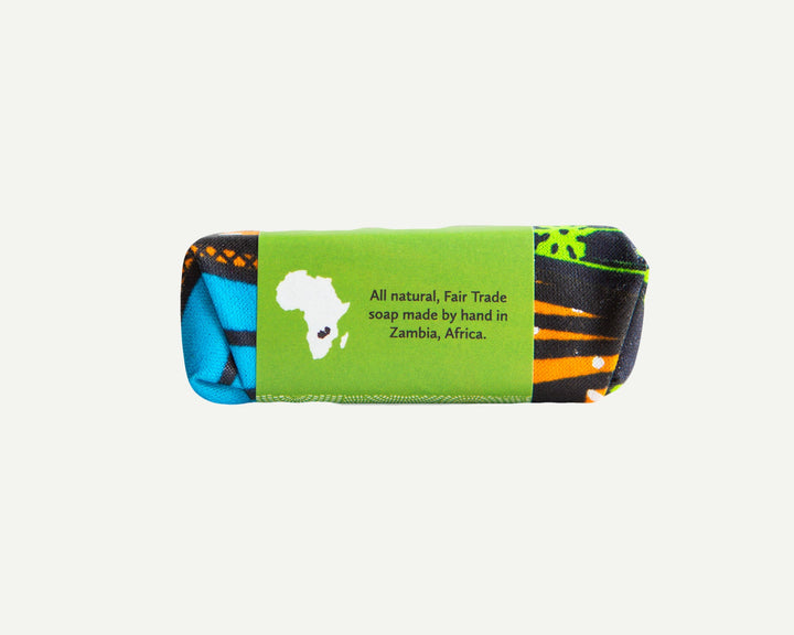 Side view of an organic lemongrass soap bar with beeswax, natural texture.