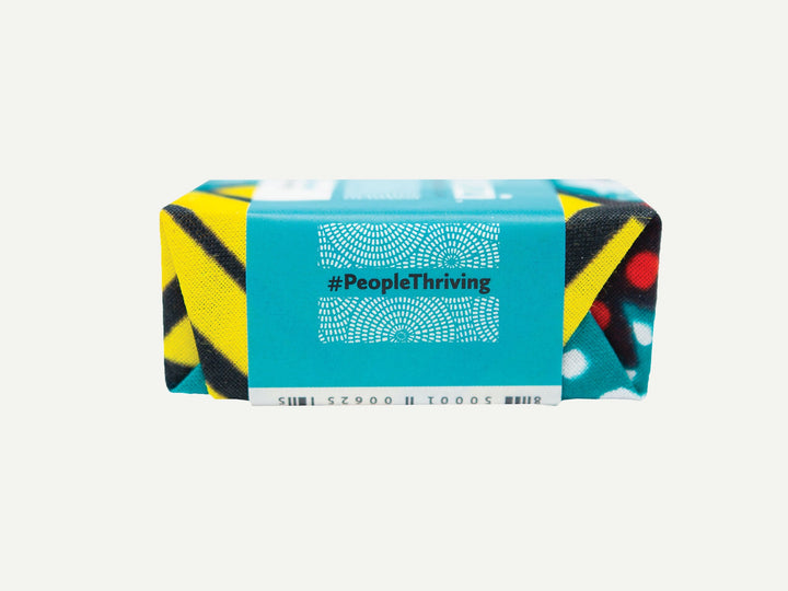 Organic tea tree soap bar with beeswax and honey, showing natural texture.