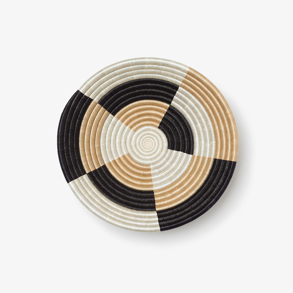 Medium Staccato woven bowl with a quarter-pinwheel pattern in natural sisal.