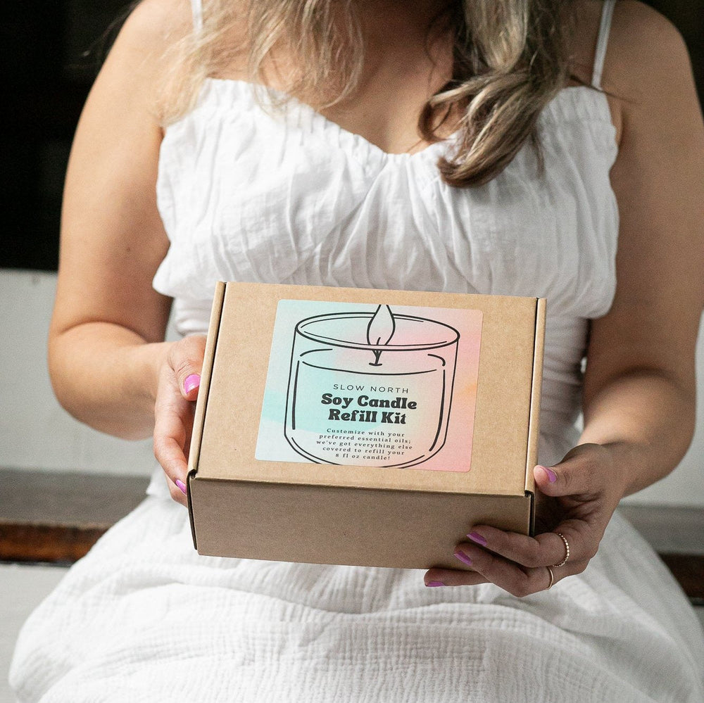 DIY candle refill kit with soy wax, wicks, and essential oils.