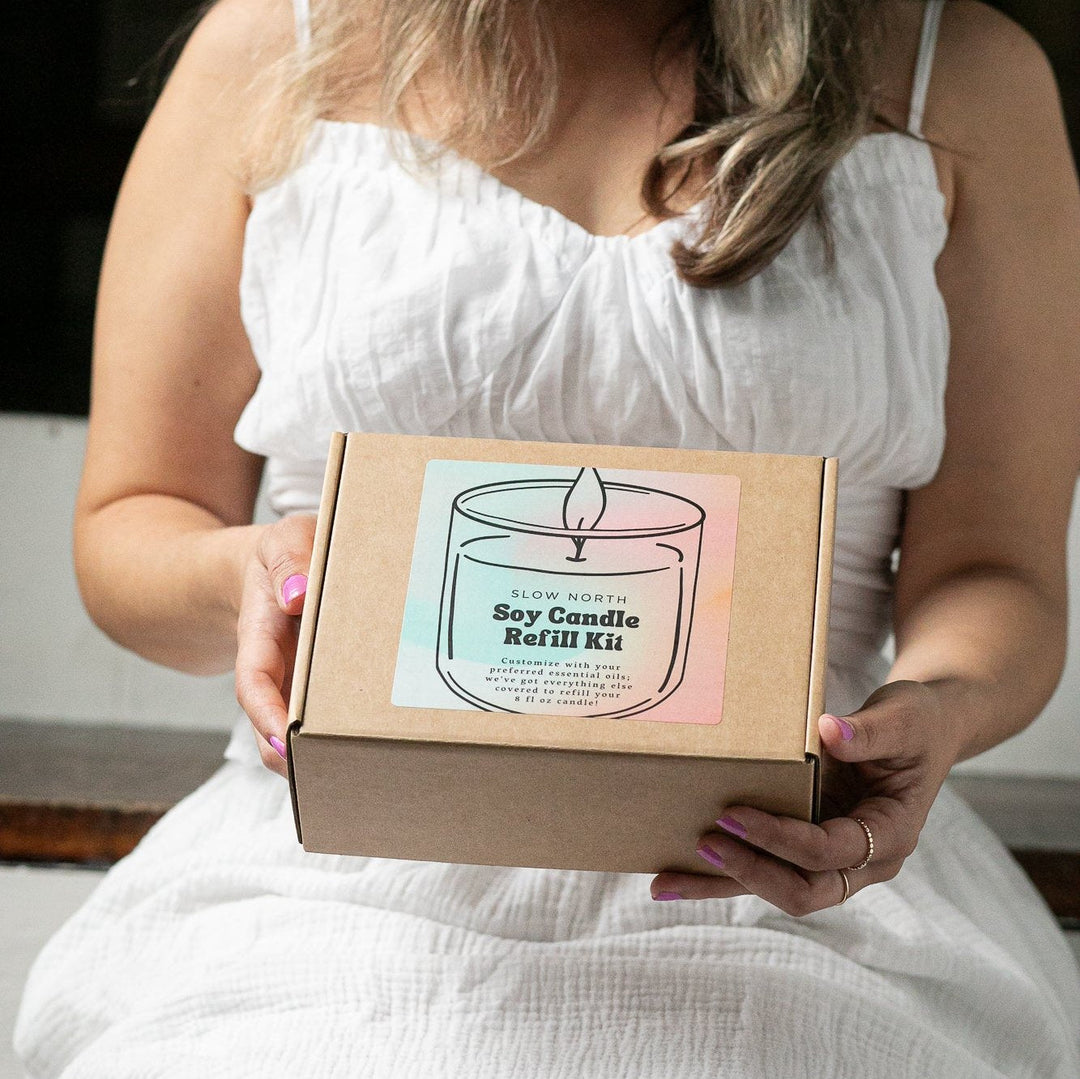 DIY candle refill kit with soy wax, wicks, and essential oils.