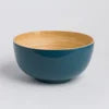 Large handcrafted bamboo salad bowl with a smooth natural surface.