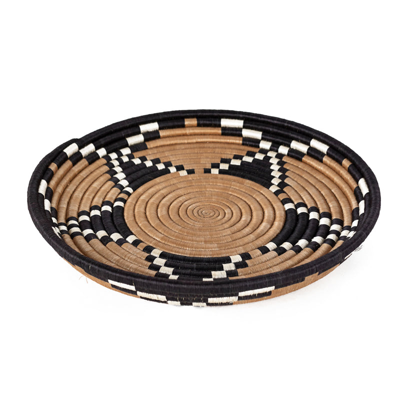 Tea Blossom woven bowl in tea-dyed sisal with black and white checkered detail.