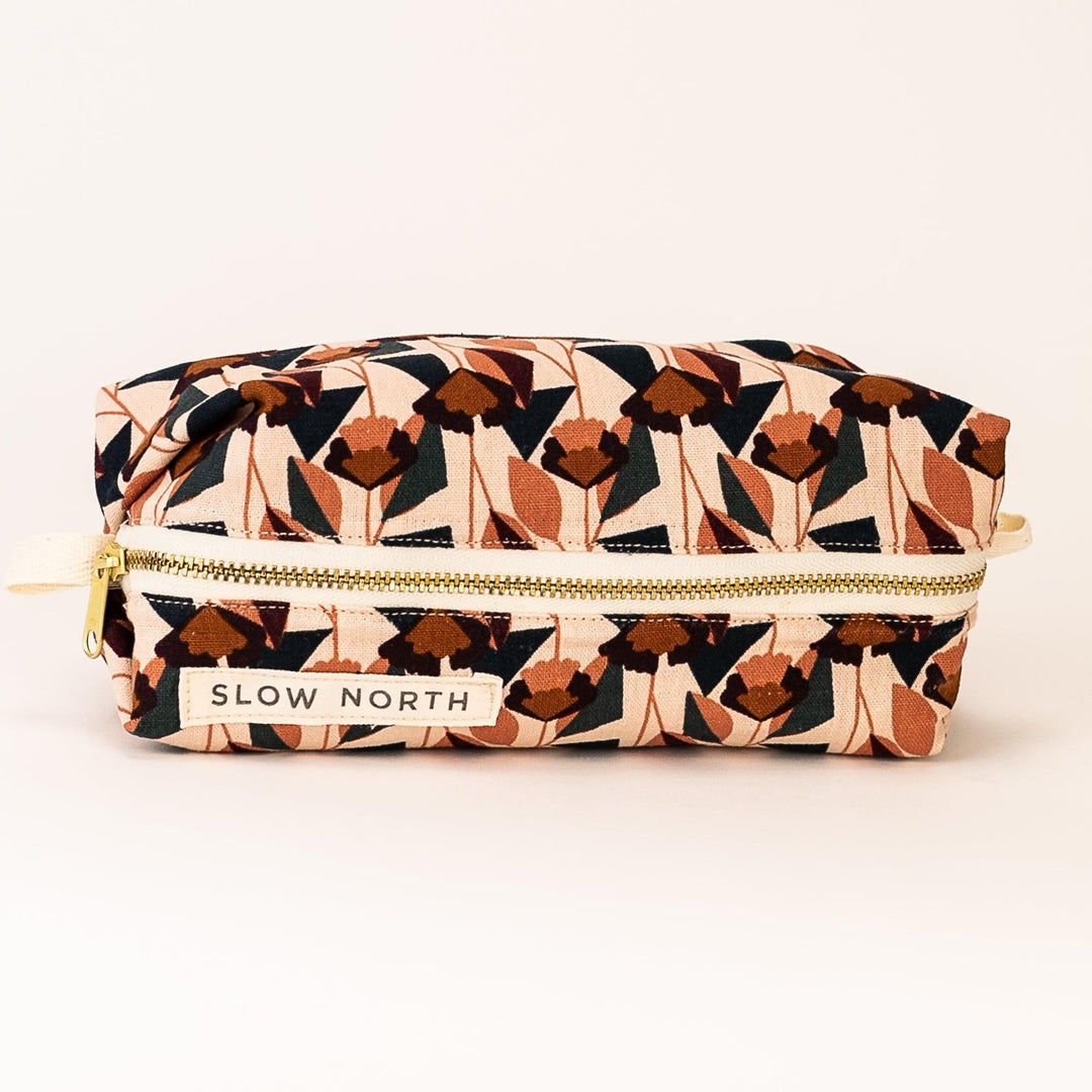 Florence travel pouch with floral print on blush cotton-linen exterior.