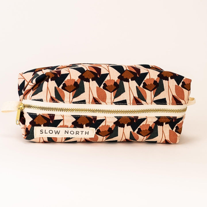 Florence travel pouch with floral print on blush cotton-linen exterior.