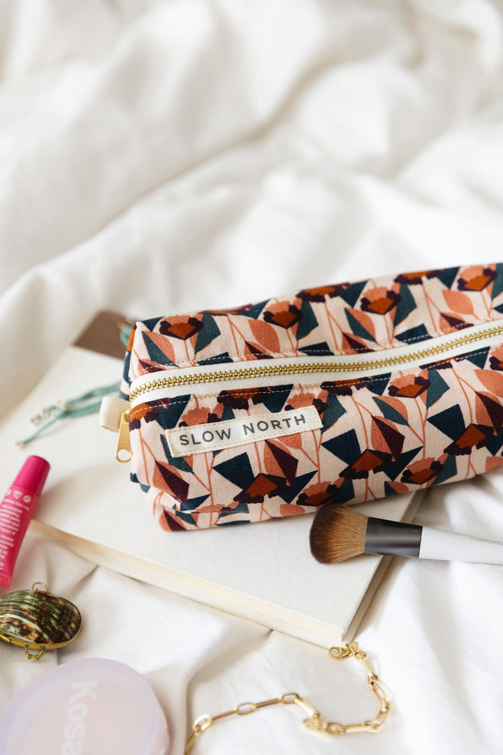 Cotton-linen travel pouch with soft blush tones and floral print.
