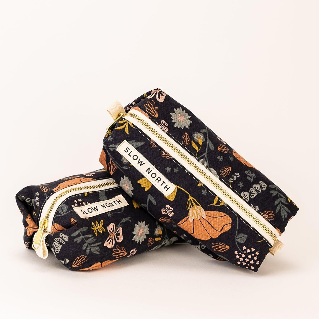 Canyon Springs travel pouch shown with rustic textured fabric.