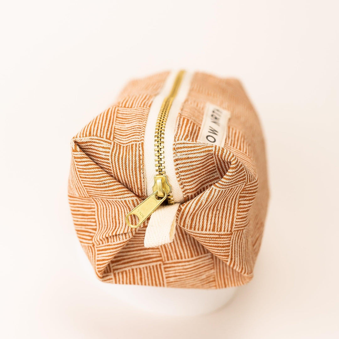 Copper Fields travel pouch with textured exterior and self-standing shape.